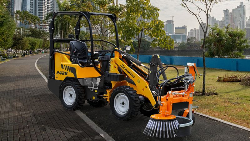 Street sweeping compact loader