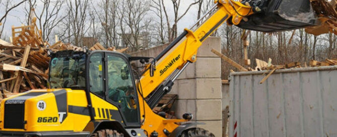 Loader dropping wood