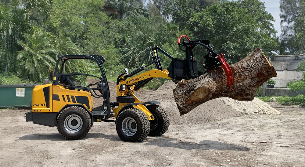 2430 SLT wheel loader with Red Grapple